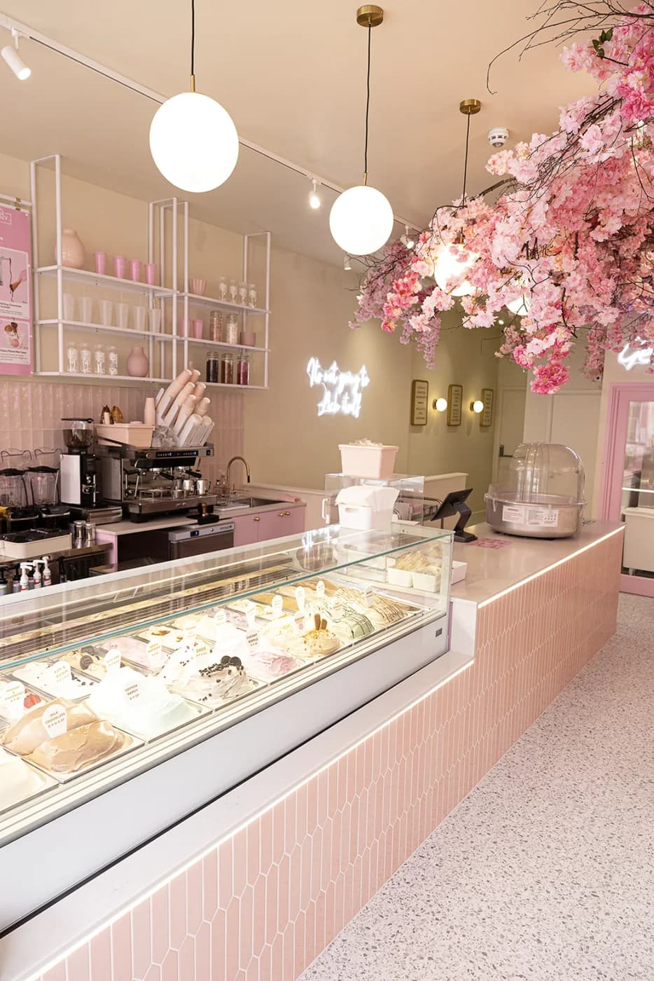 The gelato counter running the length of the parlour, under the blossom